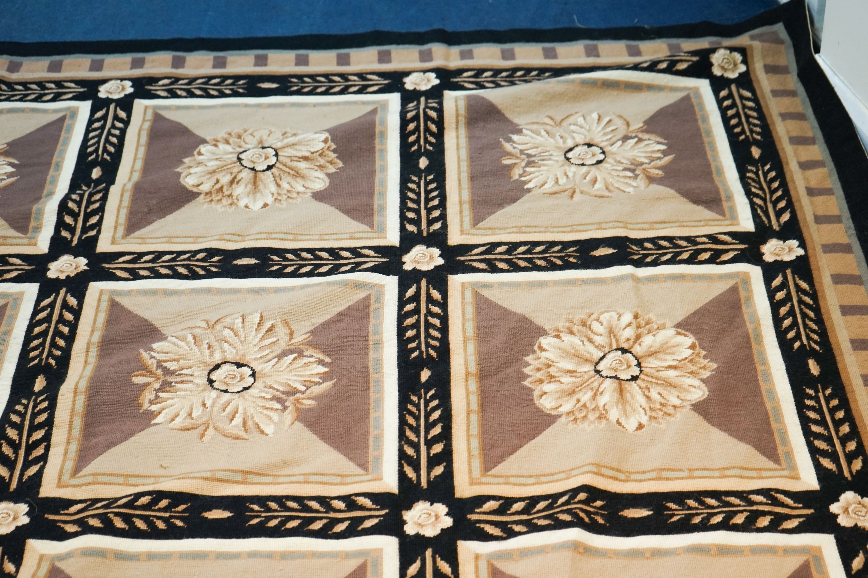 An Aubusson style floral tapestry carpet, 320 x 300cm